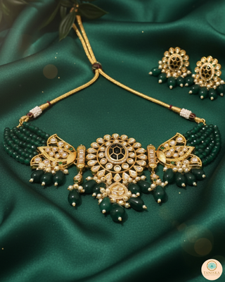 Luxury green emerald beaded Kundan choker set with matching earrings, an elegant statement piece for South Asian bridal weddings and nikah ceremonies, as seen in www.taniska.com