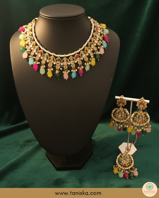 Luxury multicolor beaded Kundan bridal necklace set with matching earrings and maang tikka, vibrant statement jewelry for South Asian weddings and festive celebrations.