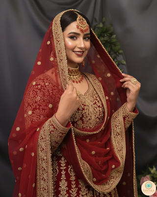 Luxury red and gold Kundan bridal necklace set with matching earrings and maang tikka, statement jewelry for South Asian weddings and nikah ceremonies.