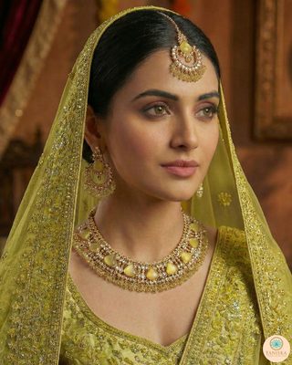 Luxury yellow Kundan bridal necklace set with matching earrings and maang tikka, elegant statement jewelry for South Asian weddings and nikah ceremonies.