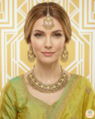 Luxury yellow Kundan bridal necklace set with matching earrings and maang tikka, elegant statement jewelry for South Asian weddings and nikah ceremonies.