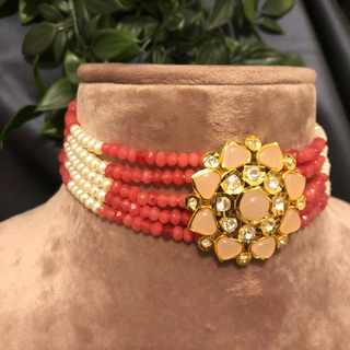 Luxury coral and peach beaded Kundan choker necklace set with matching earrings, elegant statement jewelry for South Asian bridal weddings and receptions.