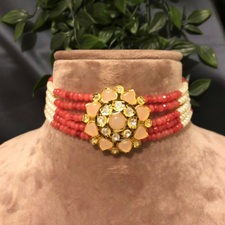 Luxury coral and peach beaded Kundan choker necklace set with matching earrings, elegant statement jewelry for South Asian bridal weddings and receptions.