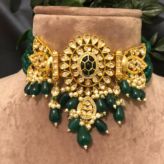 Luxury green emerald beaded Kundan choker set with matching earrings, an elegant statement piece for South Asian bridal weddings and nikah ceremonies, as seen in www.taniska.com