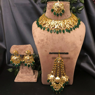 Luxury green glass work Kundan bridal necklace set with matching earrings and headpiece, statement jewelry for South Asian weddings and nikah ceremonies.