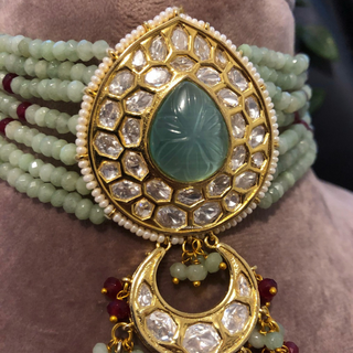 Luxury green beaded Kundan choker necklace set with matching earrings, perfect for South Asian bridal weddings and receptions.
