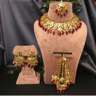 Luxury maroon glass work Kundan bridal necklace set with matching earrings and headpiece, statement jewelry for South Asian weddings and nikah ceremonies.