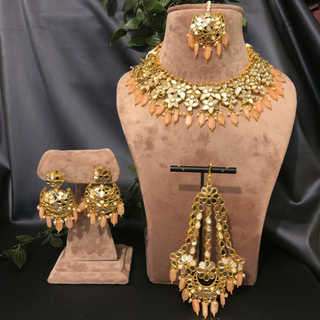 Luxury peach glass work Kundan bridal necklace set with matching earrings and headpiece, statement jewelry for South Asian weddings and nikah ceremonies.